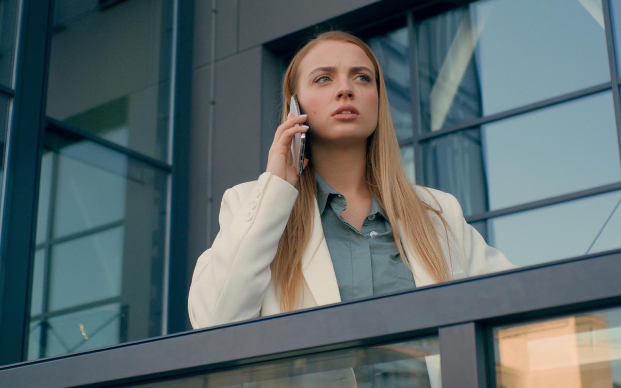 Strict dissatisfied angry Caucasian businesswoman woman female talking mobile smartphone phone answering call. Employee girl manager discuss problem explaining business plan argue city outside office. High quality 4k footage